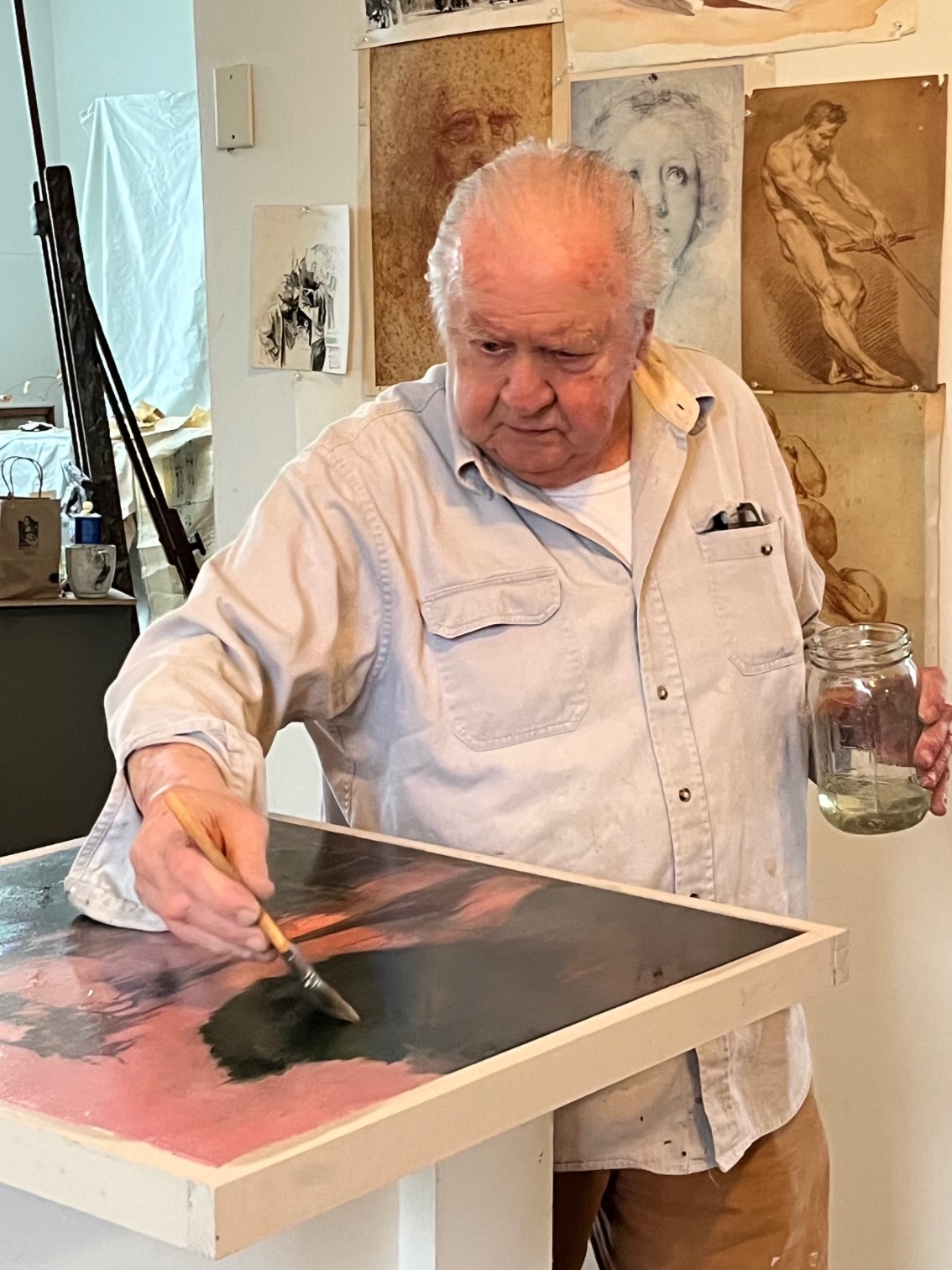 Read more about the article Auseklis Ozols Varnishing a New Painting, 2024.  Work on view at the Abita Trailhead Museum April 12-14, 2024.