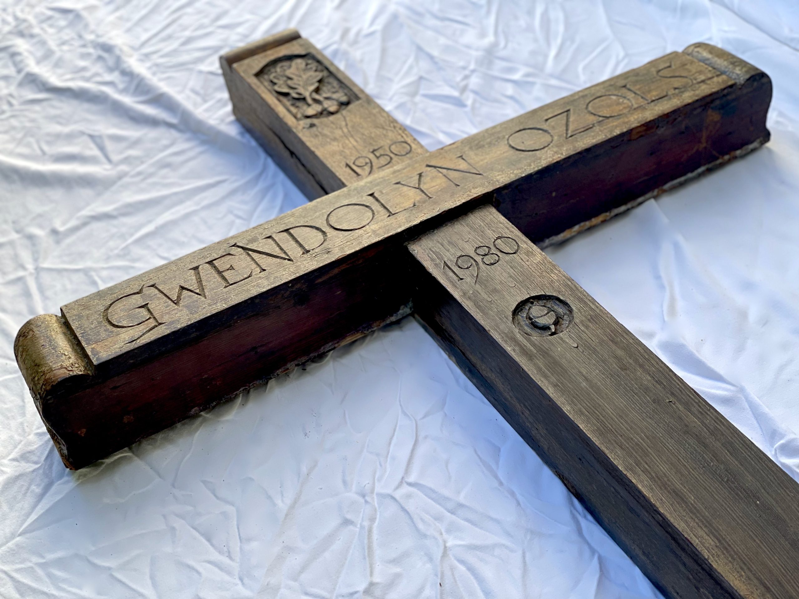 Read more about the article Artifact/Archives:  Hand carved art objects by Auseklis Ozols. Wooden Cross for the Grave of Gwendolyn Laan Ozols